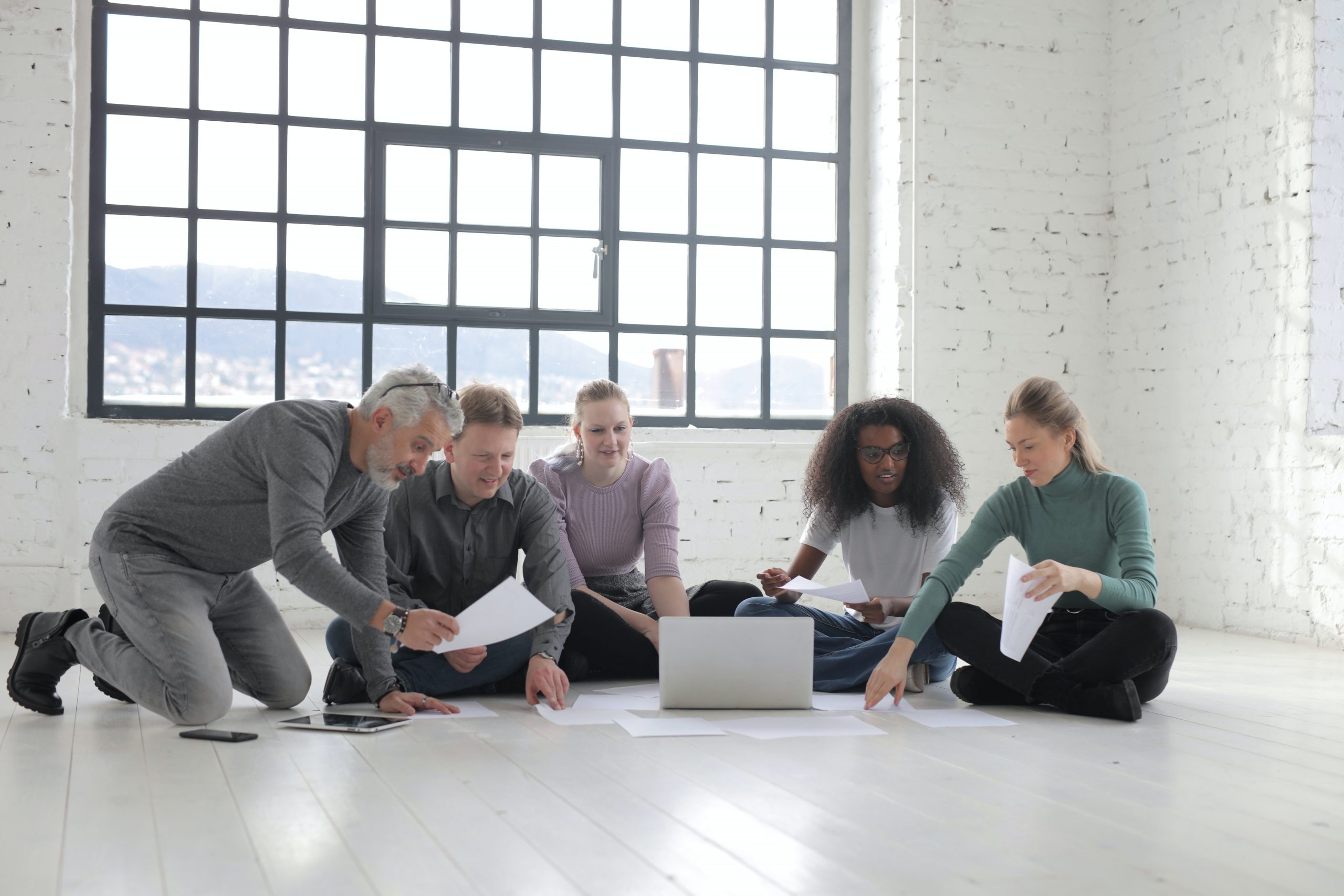group-of-people-sitting-on-the-floor-while-working-3863830 (1)